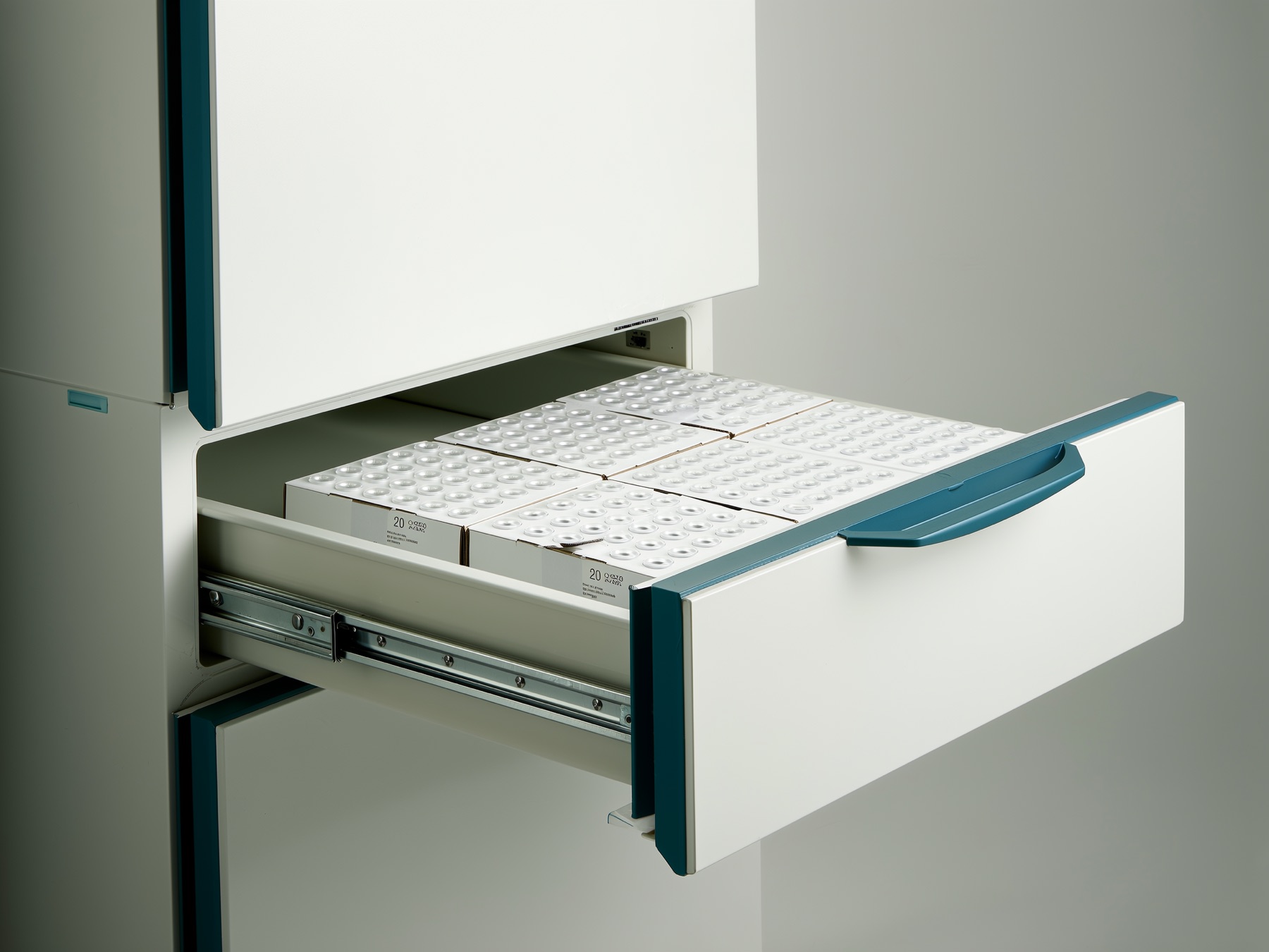 A laboratory freezer drawer holding boxed vials at minus 20 degrees